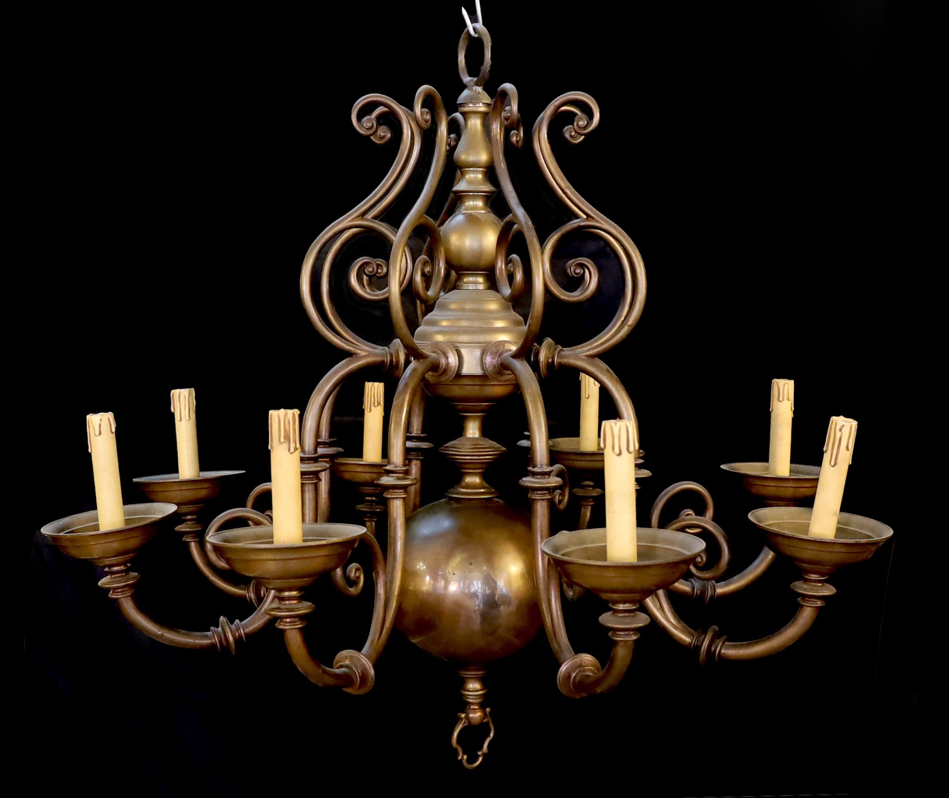 An early 20th century 17th century Dutch style brass eight light chandelier, height 82cm width 82cm